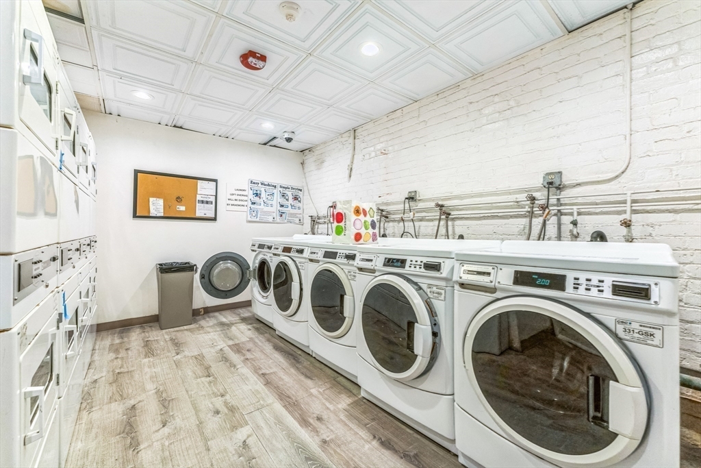 466 Commonwealth Avenue, Unit 301 Boston, MA 02215 - Photo 9 of 14 a utility room with dryer and washer