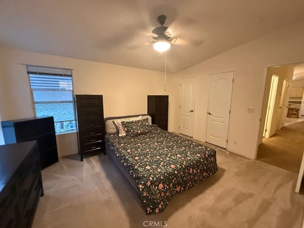 1001 South Hale, Unit 13 Escondido, CA 92025 - Photo 11 of 20 a bedroom with a bed and a television