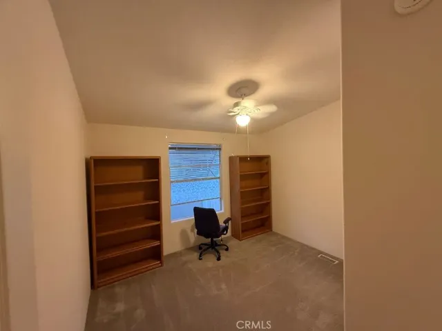 a view of a livingroom with a bookshelf