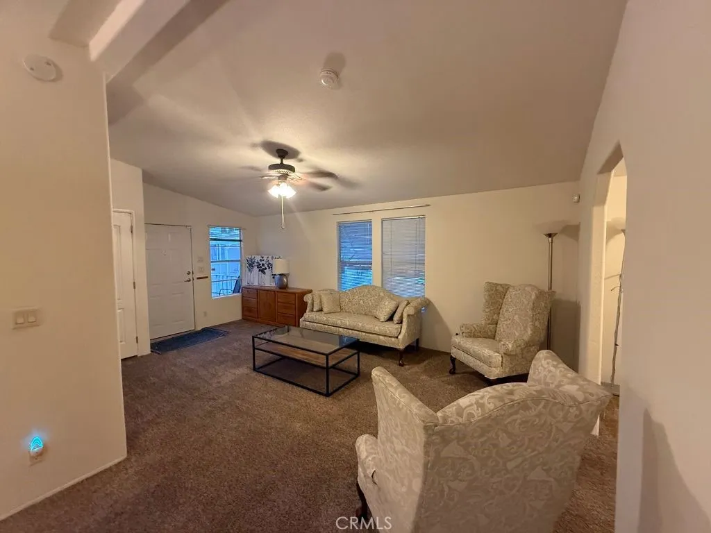 1001 South Hale, Unit 13 Escondido, CA 92025 - Photo 4 of 20 a living room with furniture and a chandelier
