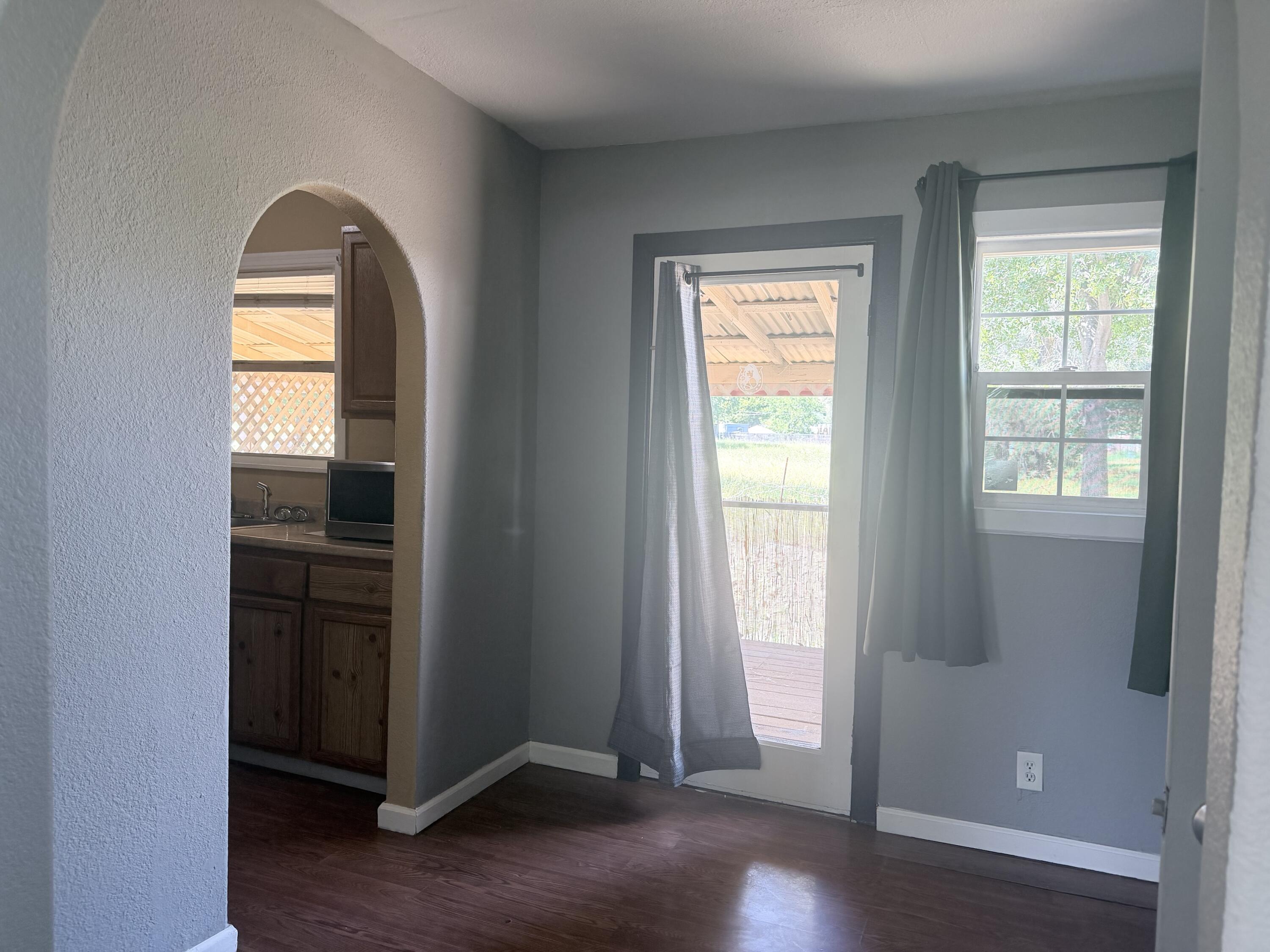 2230 El Reno Lane Redding, CA 96001 - Photo 21 of 27 an empty room with wooden floor closet and windows