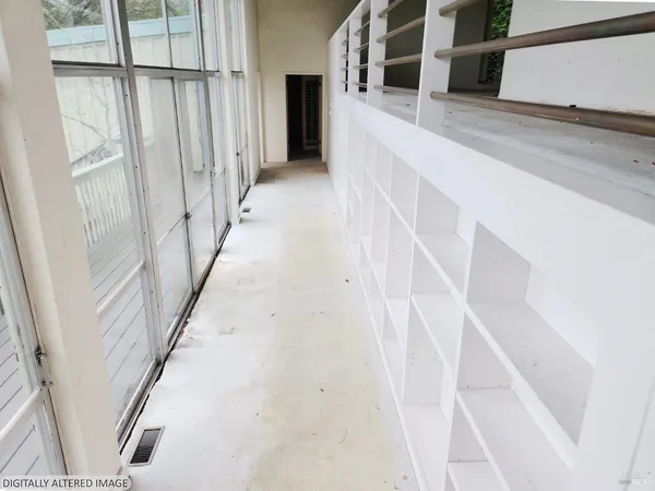 a view of staircase with lots of white walls