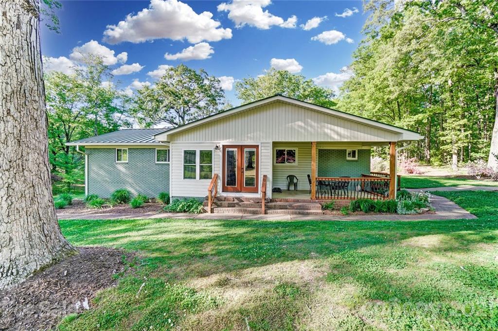 2579 Anderson Road South Catawba, SC 29704 - Photo 1 of 47 a front view of a house with a yard porch and outdoor seating