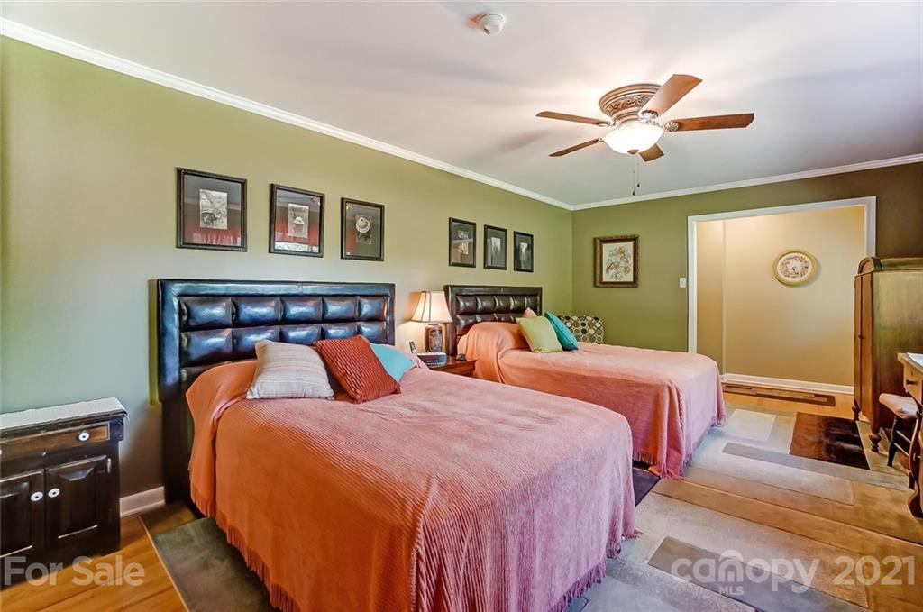 2579 Anderson Road South Catawba, SC 29704 - Photo 22 of 47 a bedroom with bed and a chandelier