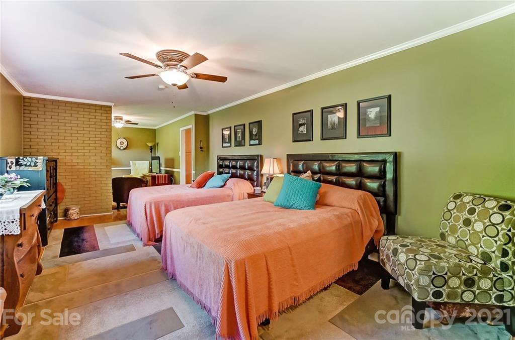 2579 Anderson Road South Catawba, SC 29704 - Photo 23 of 47 a bedroom with a bed and a chandelier