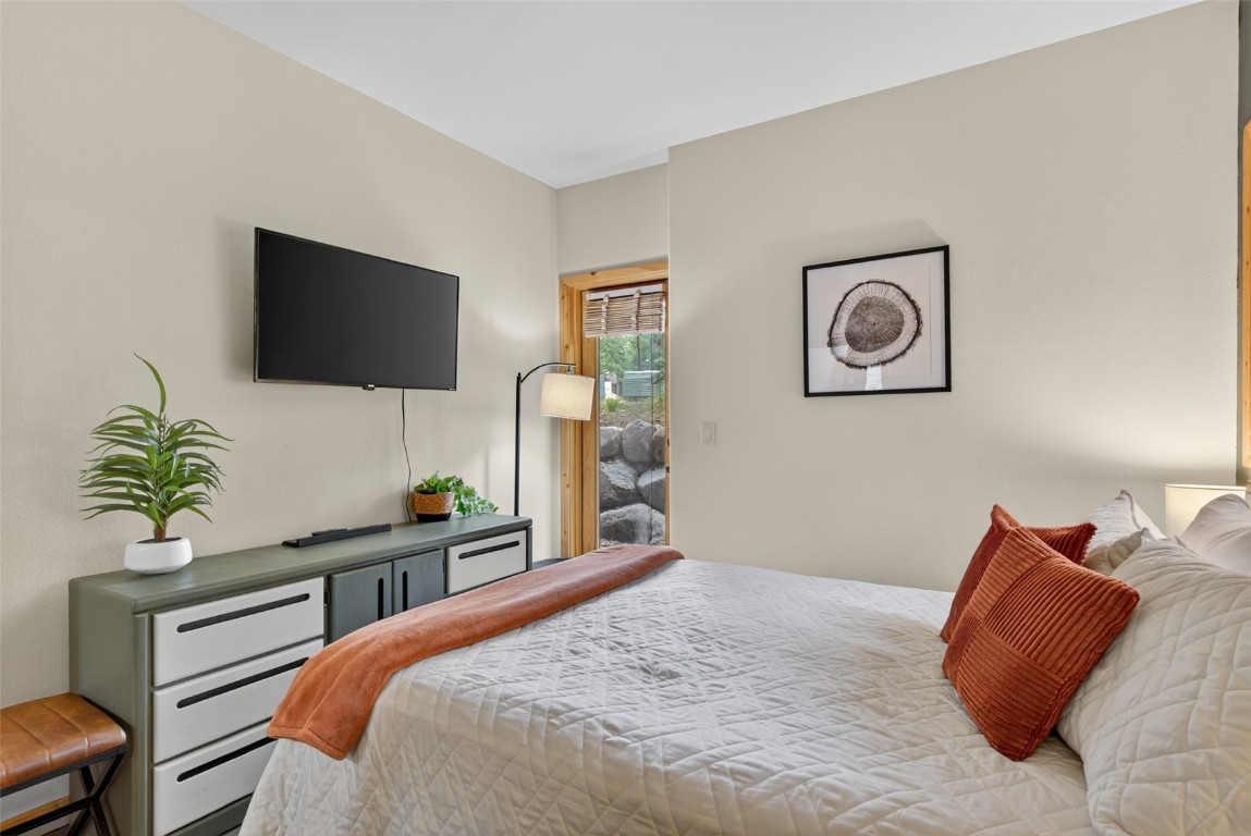 260 Ski Hill Road, Unit 6 Breckenridge, CO 80424 - Photo 15 of 25 Master Bedroom with outside access door