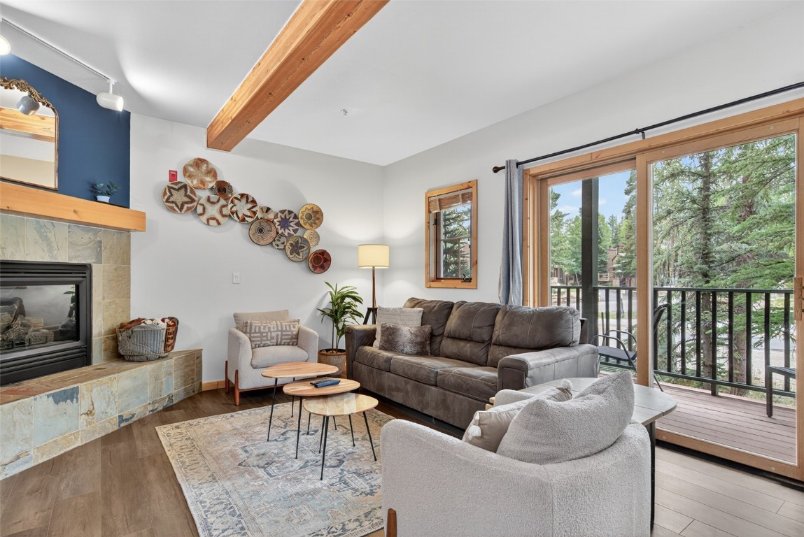 260 Ski Hill Road, Unit 6 Breckenridge, CO 80424 - Photo 2 of 25 Living area with beamed ceiling, wood finished floors
