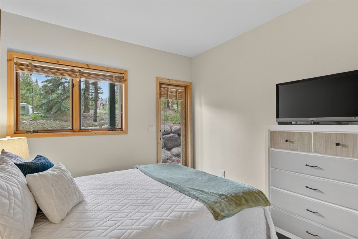 260 Ski Hill Road, Unit 6 Breckenridge, CO 80424 - Photo 21 of 25 Guest Bathroom featuring a shower stall and vanity