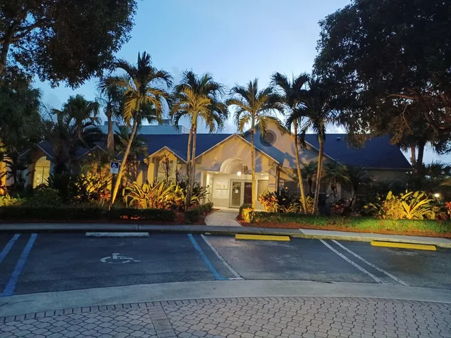 a view of yard with yellow lighting