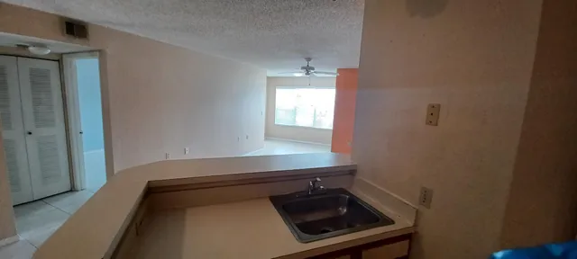a close view of a sink and a stove in a room