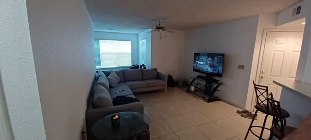 a living room with furniture and a window