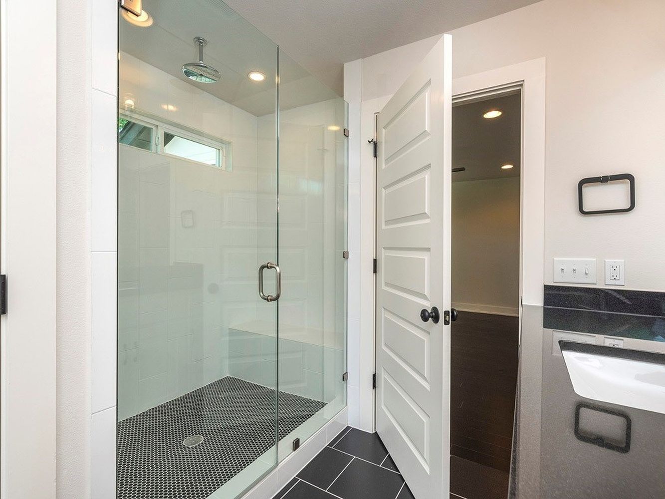 1182 Ridgeway Drive, Unit A Austin, TX 78702 - Photo 16 of 27 Bathroom with a shower stall, dark tile patterned flooring, and recessed lighting
