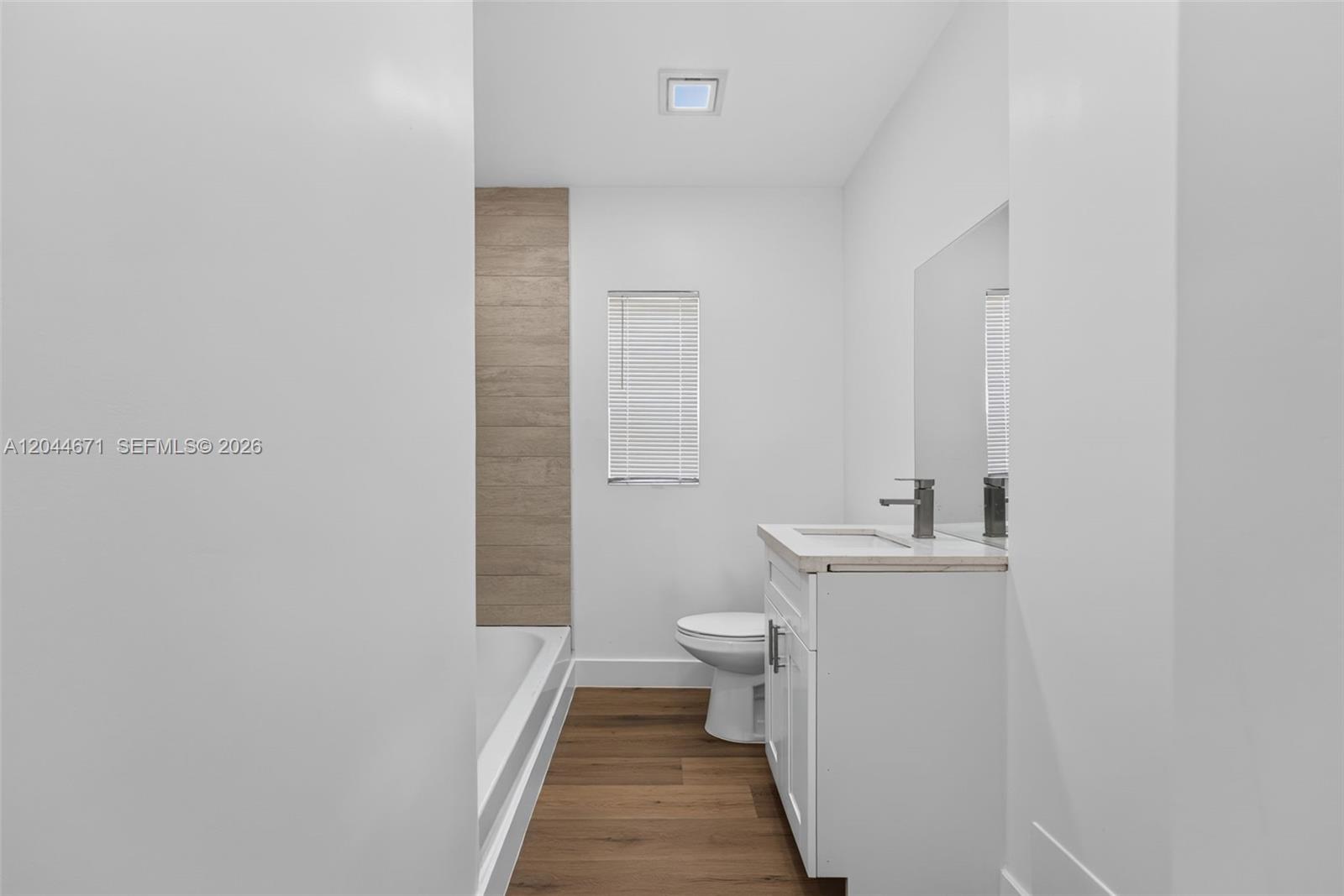 1900 Southwest 6th Street, Unit 6 Miami, FL 33135 - Photo 11 of 20 a bathroom with a toilet and a sink