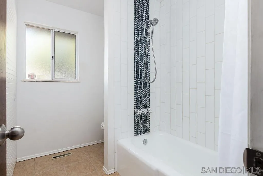 6778 West Lilac Road Bonsall, CA 92003 - Photo 12 of 45 a bathroom with a bathtub