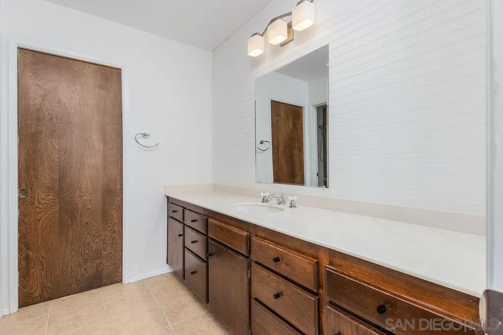 6778 West Lilac Road Bonsall, CA 92003 - Photo 14 of 45 a bathroom with a sink and a mirror