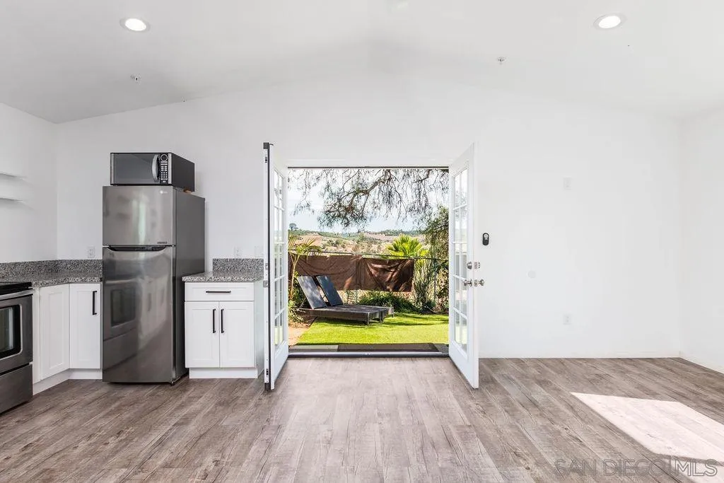 6778 West Lilac Road Bonsall, CA 92003 - Photo 20 of 45 a view of kitchen with refrigerator stove and oven