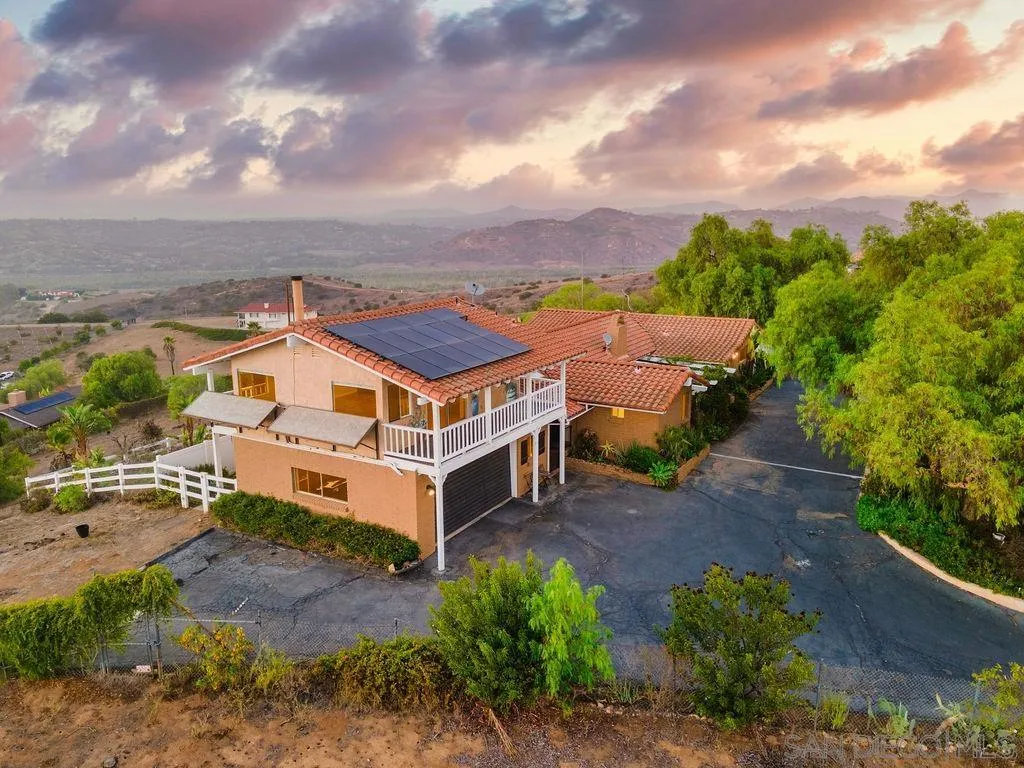 6778 West Lilac Road Bonsall, CA 92003 - Photo 2 of 45 an aerial view of a house with a big yard plants and large trees