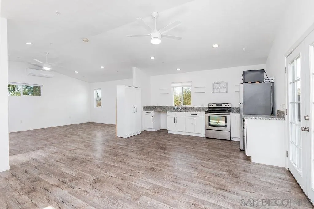 6778 West Lilac Road Bonsall, CA 92003 - Photo 22 of 45 a view of kitchen with wooden floor