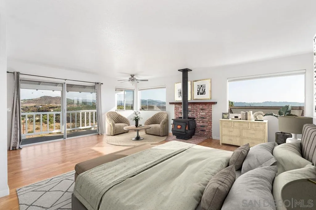 6778 West Lilac Road Bonsall, CA 92003 - Photo 30 of 45 a bedroom with furniture and a large window