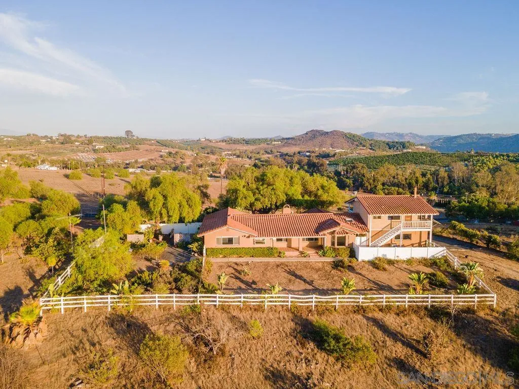 6778 West Lilac Road Bonsall, CA 92003 - Photo 37 of 45 an aerial view of residential houses with outdoor space