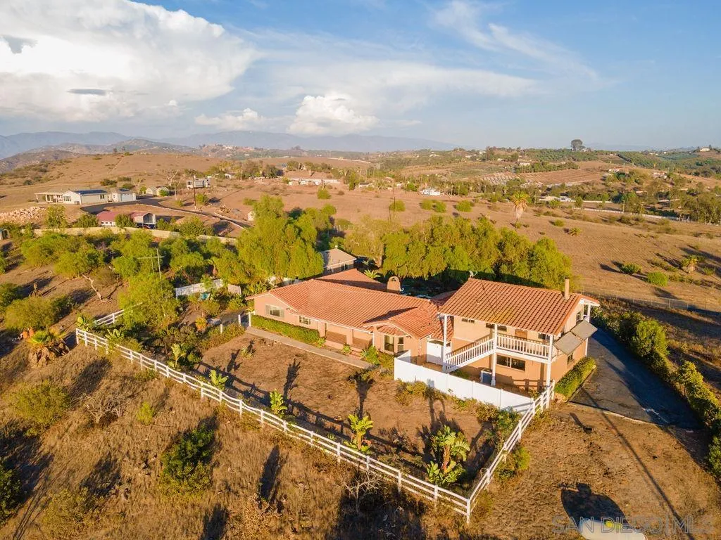 6778 West Lilac Road Bonsall, CA 92003 - Photo 38 of 45 an aerial view of residential houses with outdoor space