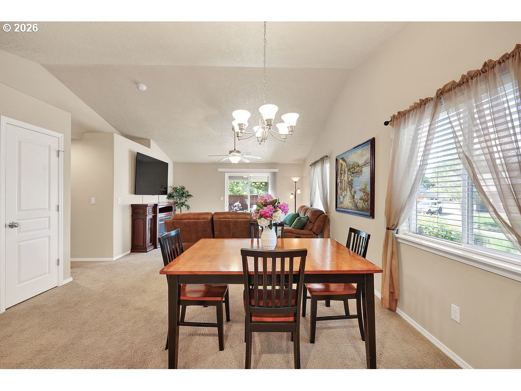 87836 8th Street Veneta, OR 97487 - Photo 20 of 25 a view of a dining room with furniture and a chandelier