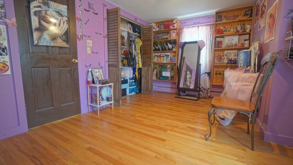 164 Prouty Street Springfield, MA 01119 - Photo 25 of 35 a bed room with a bed and a book shelf
