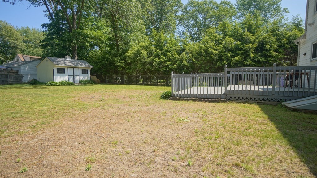 164 Prouty Street Springfield, MA 01119 - Photo 5 of 35 a view of a house with a backyard and a patio