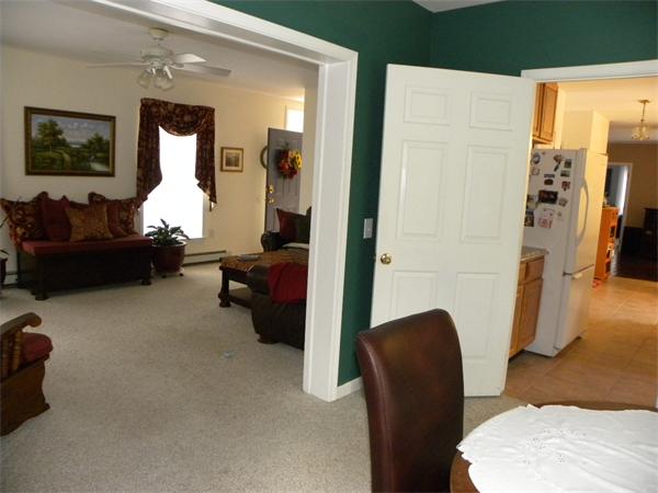 58 Baker Pond Road Dudley, MA 01571 - Photo 5 of 29 a living room with furniture rug and a large mirror