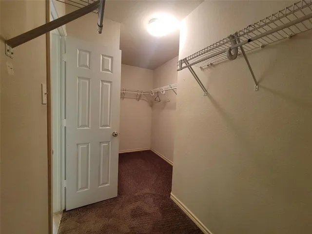 a bathroom with a sink toilet and a mirror