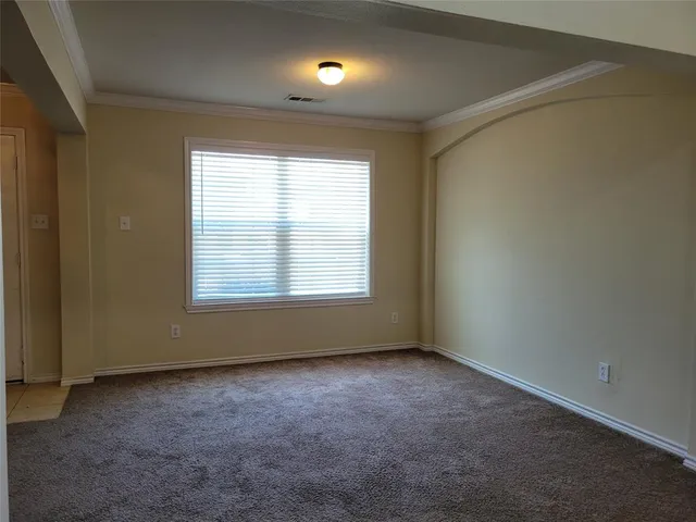 an empty room with a windows