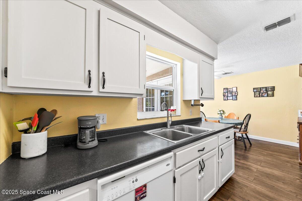 985 Sycamore Drive Rockledge, FL 32955 - Photo 12 of 26 a kitchen with a sink and cabinets
