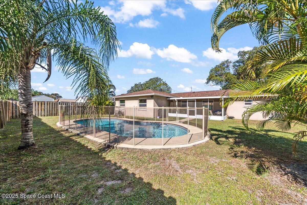 985 Sycamore Drive Rockledge, FL 32955 - Photo 2 of 26 a view of a house with a yard