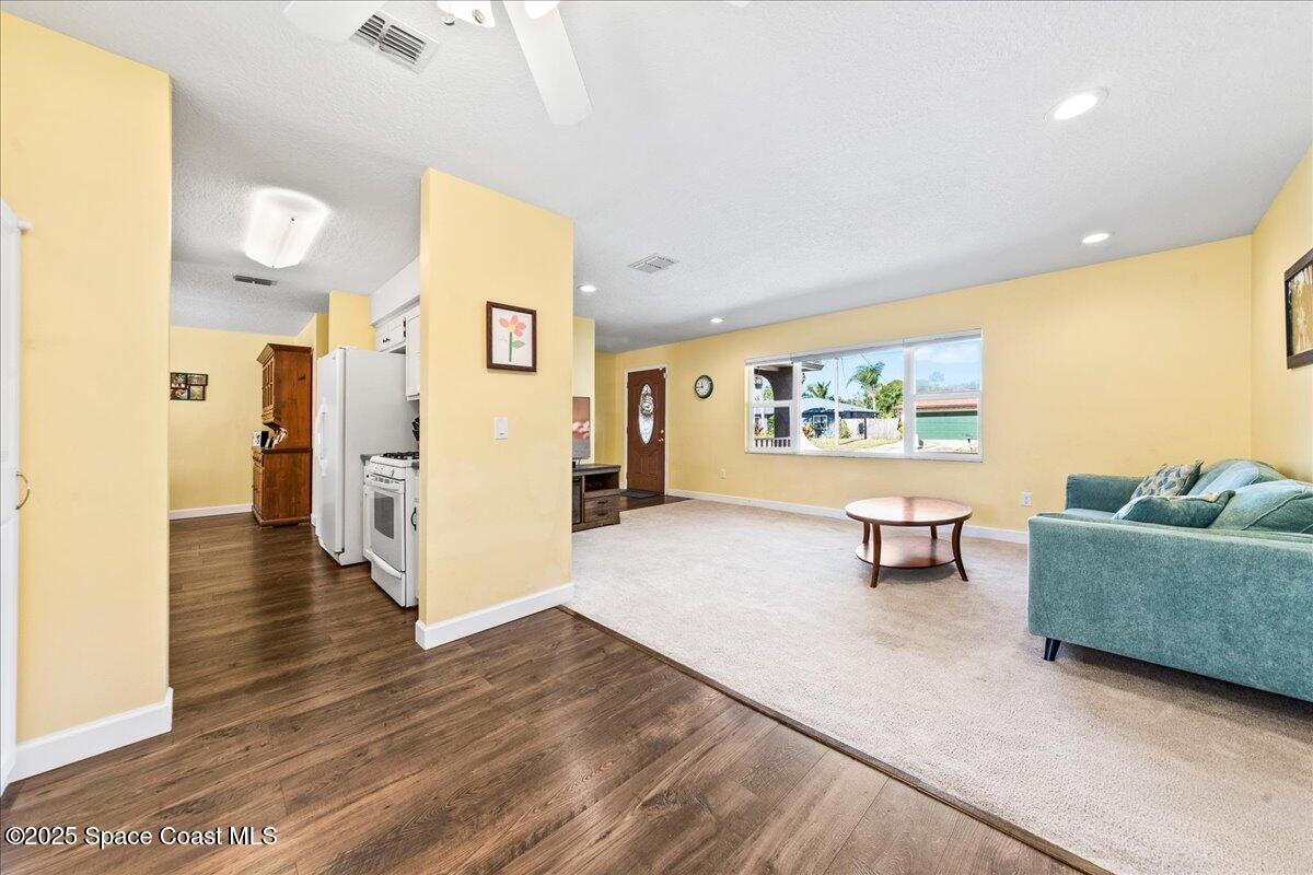 985 Sycamore Drive Rockledge, FL 32955 - Photo 6 of 26 a living room with furniture and a wooden floor