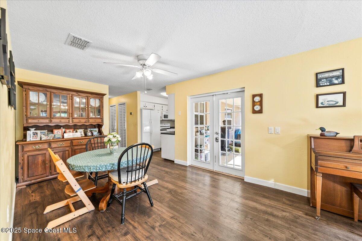 985 Sycamore Drive Rockledge, FL 32955 - Photo 9 of 26 a living room with furniture and a floor to ceiling window