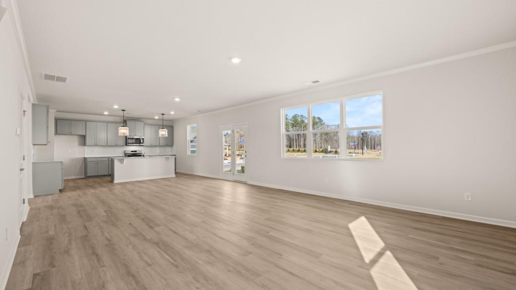 703 Anchor Avenue Villa Rica, GA 30180 - Photo 14 of 32 a view of a kitchen with wooden floor and windows