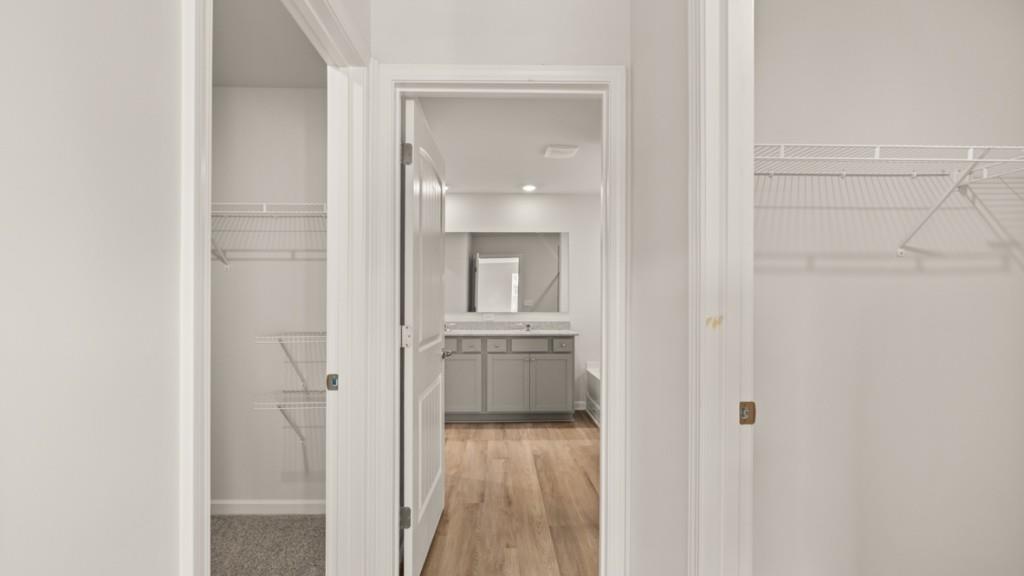 703 Anchor Avenue Villa Rica, GA 30180 - Photo 23 of 32 a view of hallway with bathroom and wooden floor