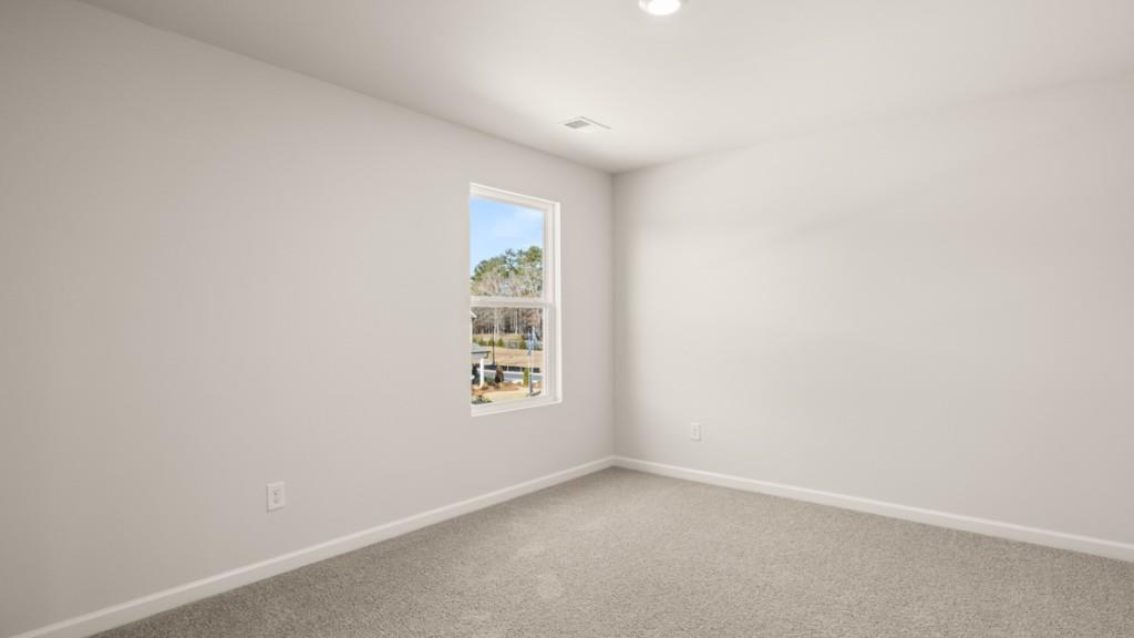 703 Anchor Avenue Villa Rica, GA 30180 - Photo 29 of 32 an empty room with windows