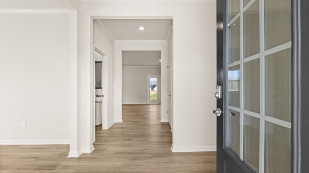 703 Anchor Avenue Villa Rica, GA 30180 - Photo 4 of 32 a view of a hallway with wooden floor