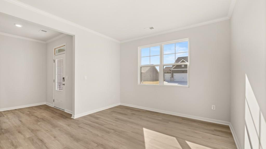 703 Anchor Avenue Villa Rica, GA 30180 - Photo 6 of 32 a view of a kitchen with wooden floor and a window