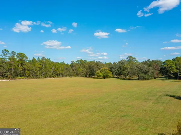 a view of a lake in middle of forest