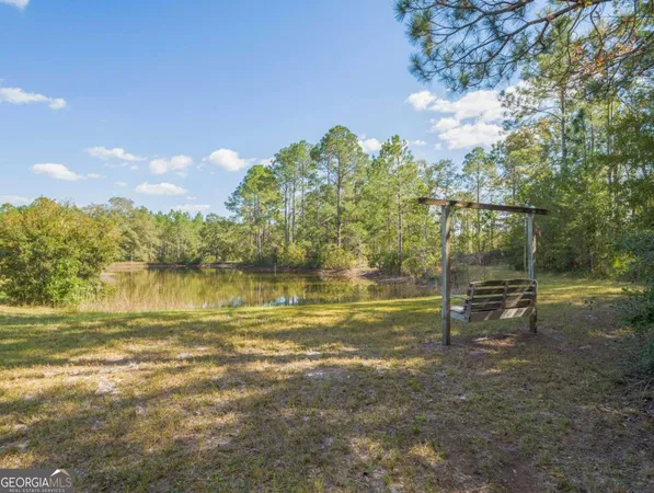 a view of an ocean and a yard