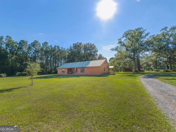 a view of a lake with a big yard
