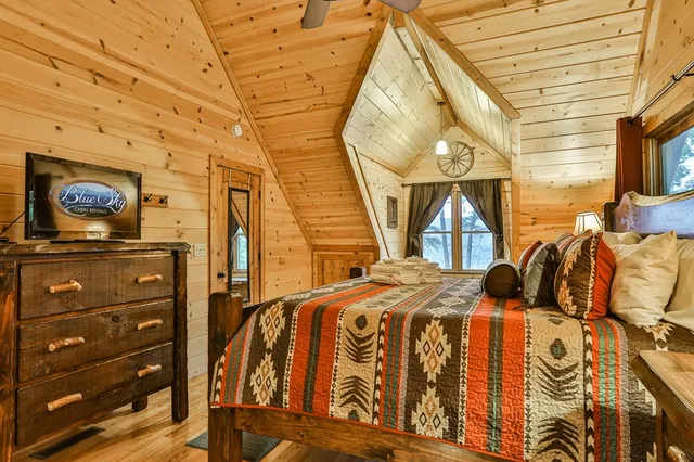 a living room with furniture a rug and a fireplace