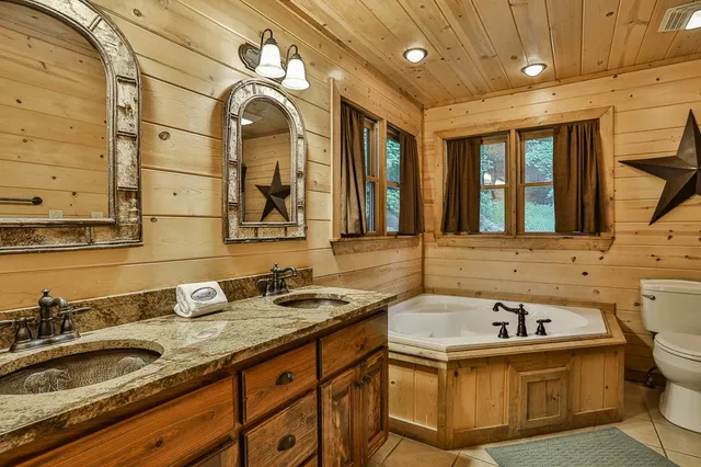 a room with pool table and windows