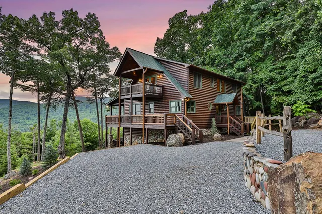 a kitchen with stainless steel appliances granite countertop a stove a sink dishwasher and a refrigerator
