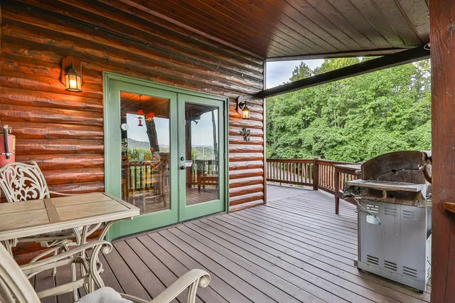 a view of a dining room with furniture wooden floor and chandelier