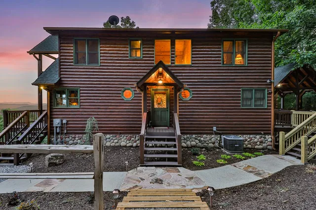 a view of a lush green field with lots of bushes