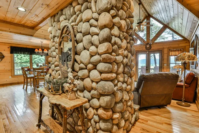 a living room with fireplace furniture and a flat screen tv