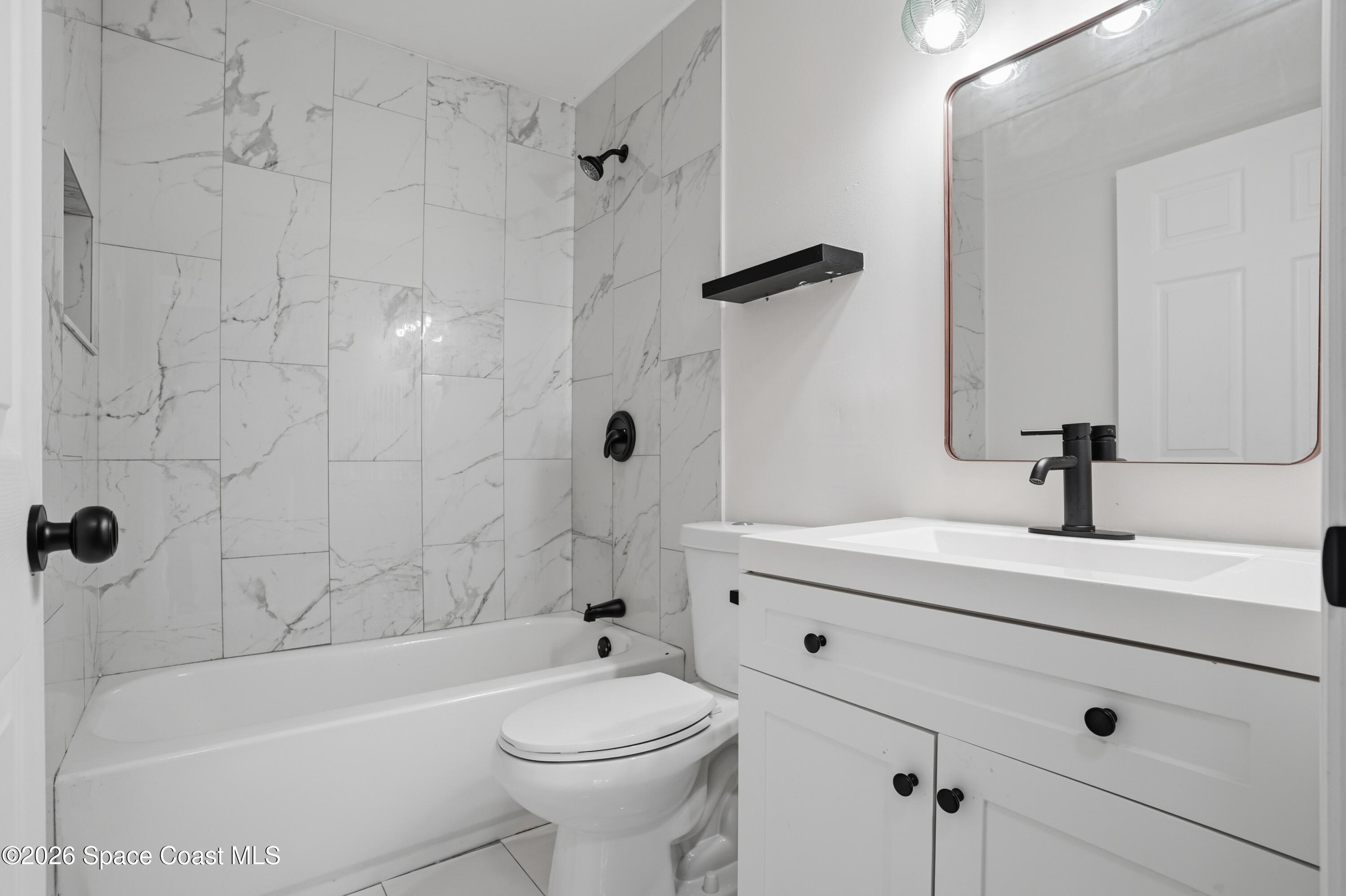 6438 Hudson Road Cocoa, FL 32927 - Photo 9 of 13 15_6438_Hudson_Rd_Cocoa_FL_32927-Bathroo